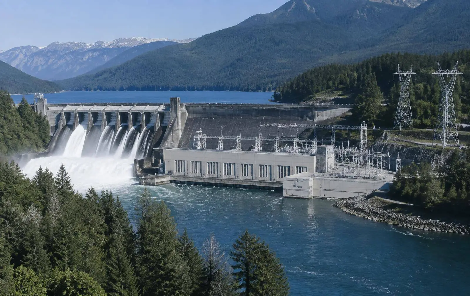 Canadian hydroelectric dam and powerhouse with transmission towers
